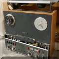 E07. Reel-to-reel player. 